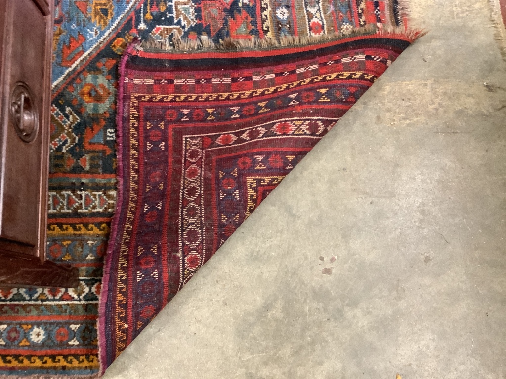 An early 20th century Shiraz blue ground carpet, 310 x 170cm